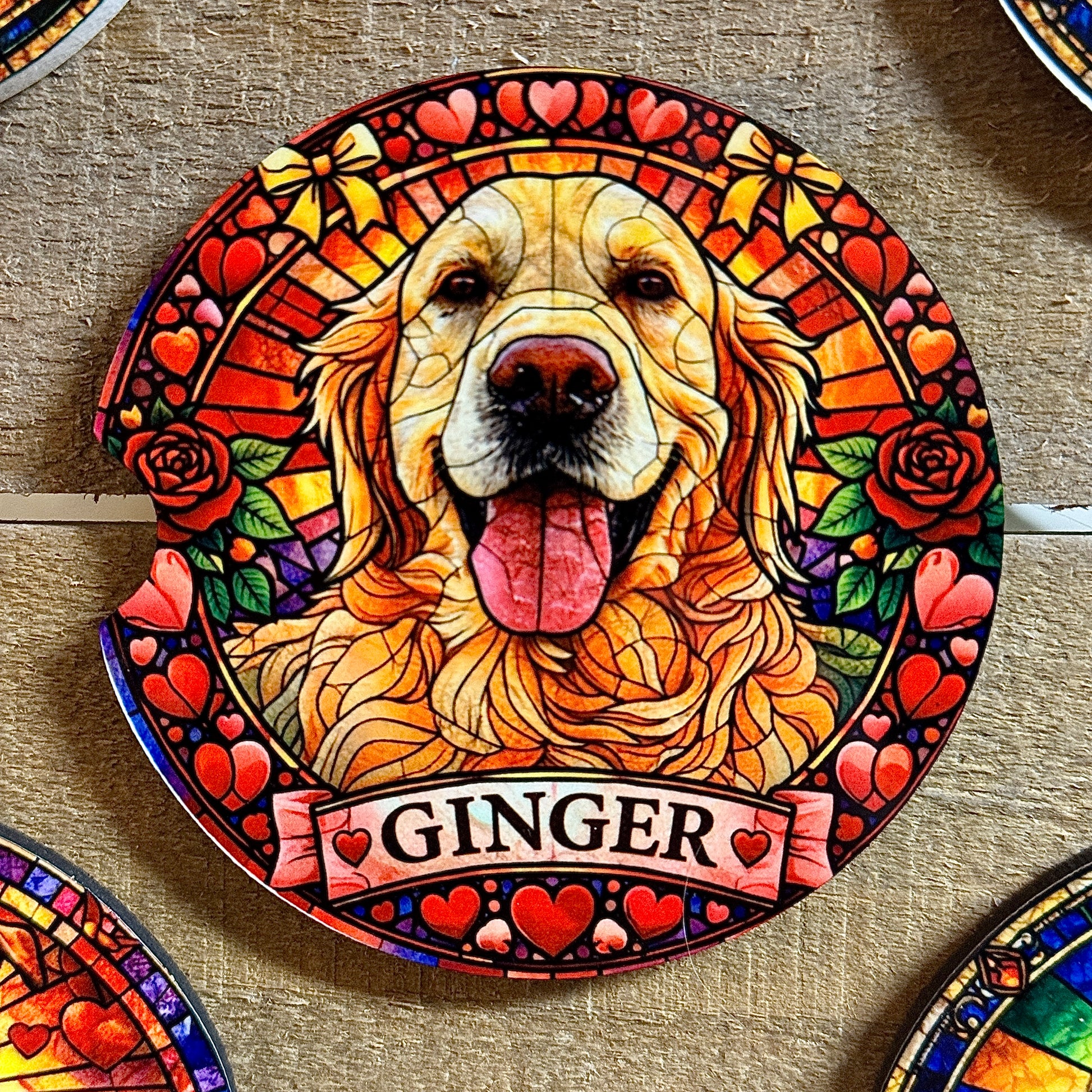 Decorative plate with a golden retriever named 'Ginger' surrounded by hearts and flowers on a wooden surface.