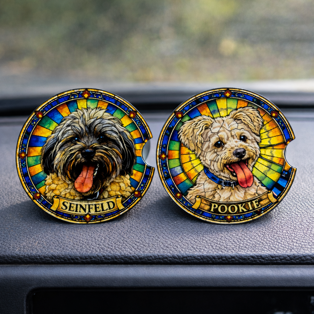 Two dog-themed coasters with 'Seinfeld' and 'Pookie' on a car dashboard.