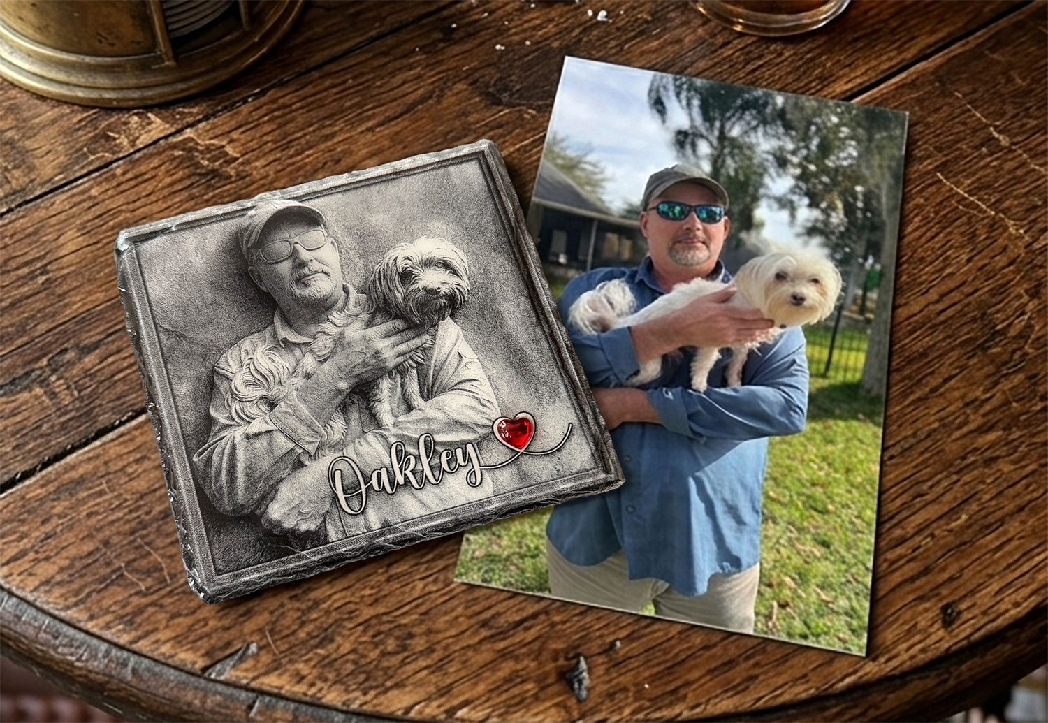Two photo prints on a wooden surface, one black and white and one color, featuring a man and a dog.