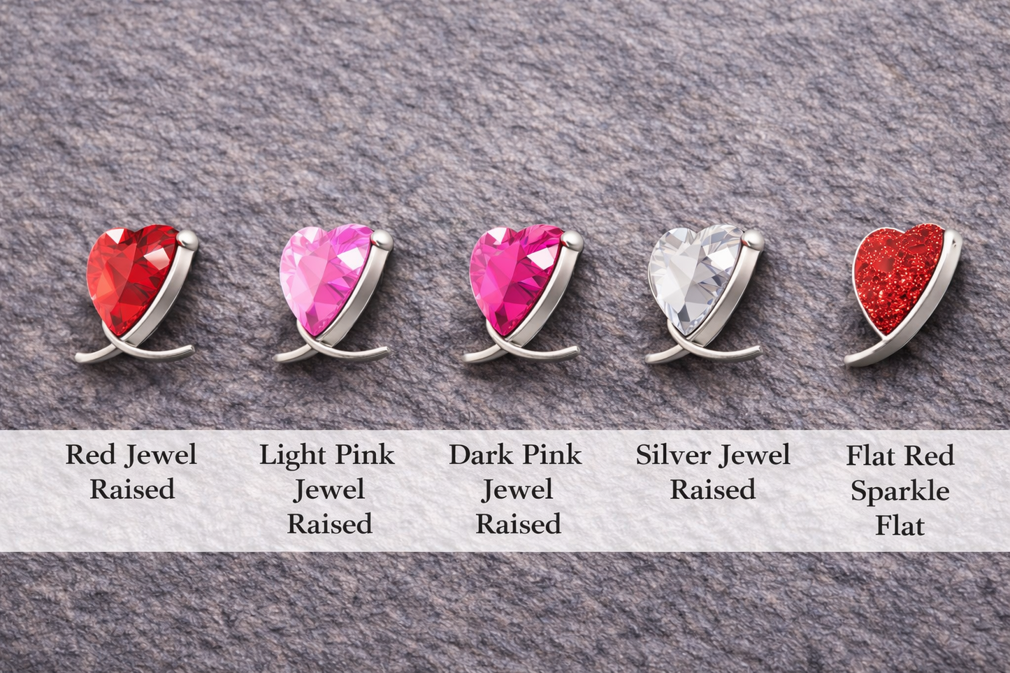 Set of heart-shaped gemstones in various colors on a gray background