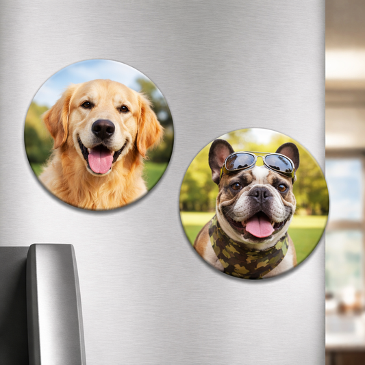 Two circular dog magnets on a refrigerator door, one with a golden retriever and the other with a bulldog wearing sunglasses.