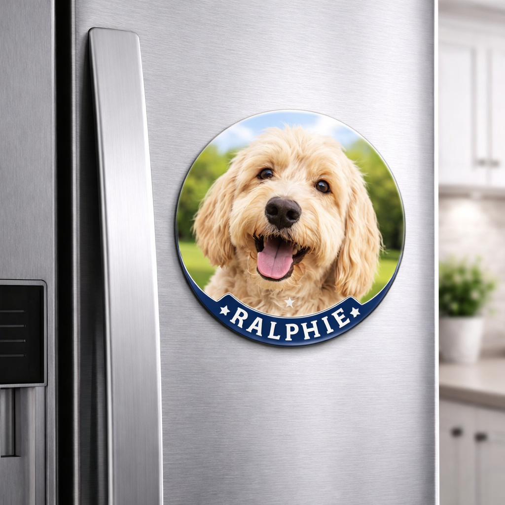Fridge magnet with a dog's face and name 'Ralphie' attached to a refrigerator.