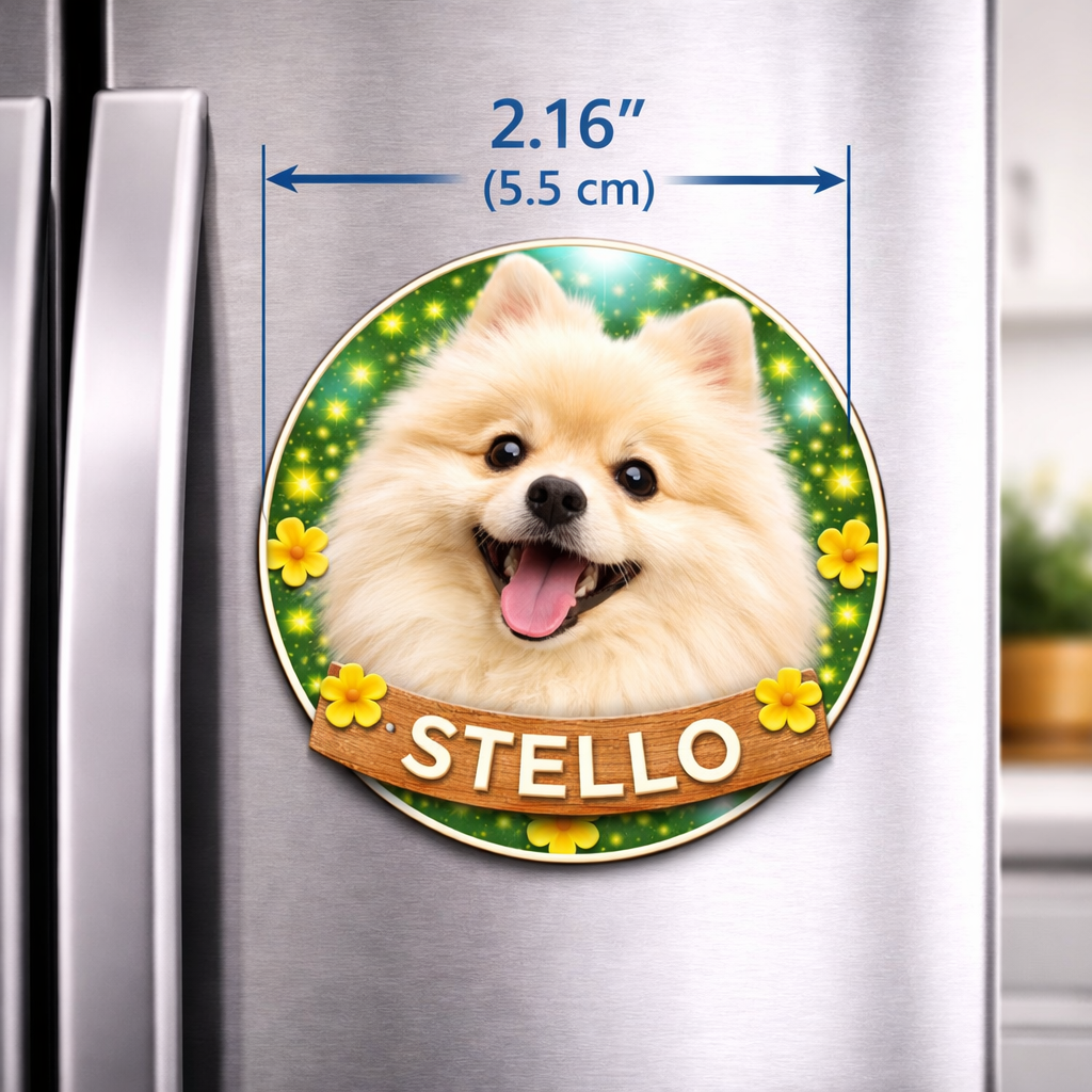 Fridge magnet with a dog's face and name 'Stello' on a green background with yellow flowers, attached to a refrigerator.
