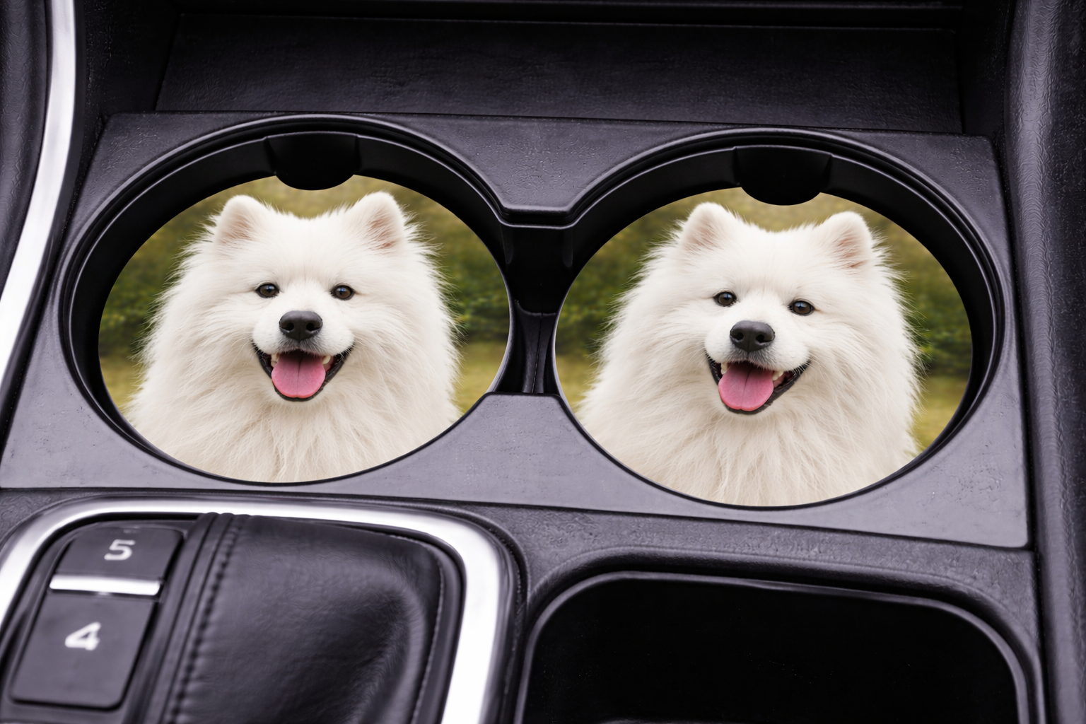 Car cup holder with two circular coasters featuring a white dog, placed inside a vehicle.
