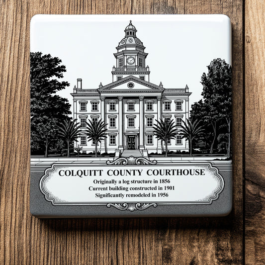 White ceramic coaster with a vintage pen-and-ink engraving of the historic Colquitt County Courthouse in Moultrie, Georgia. Features the landmark's clock tower, columns, and a historical timeline banner, displayed flat on a wood background.