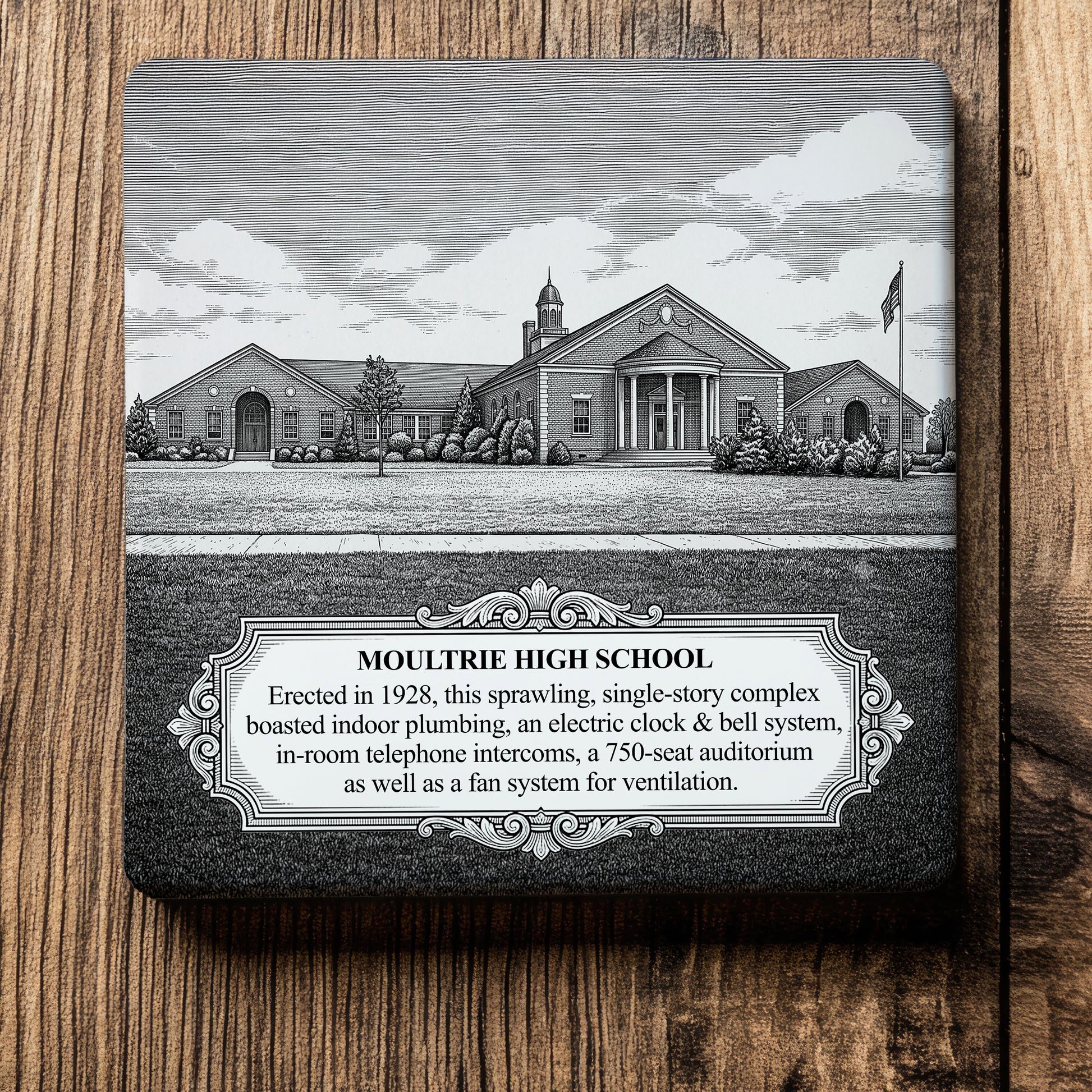 Ceramic drink coaster featuring a detailed black-and-white illustration of historic Moultrie High School in Moultrie, Georgia, with a commemorative plaque describing the school's 1928 construction and notable architectural features.